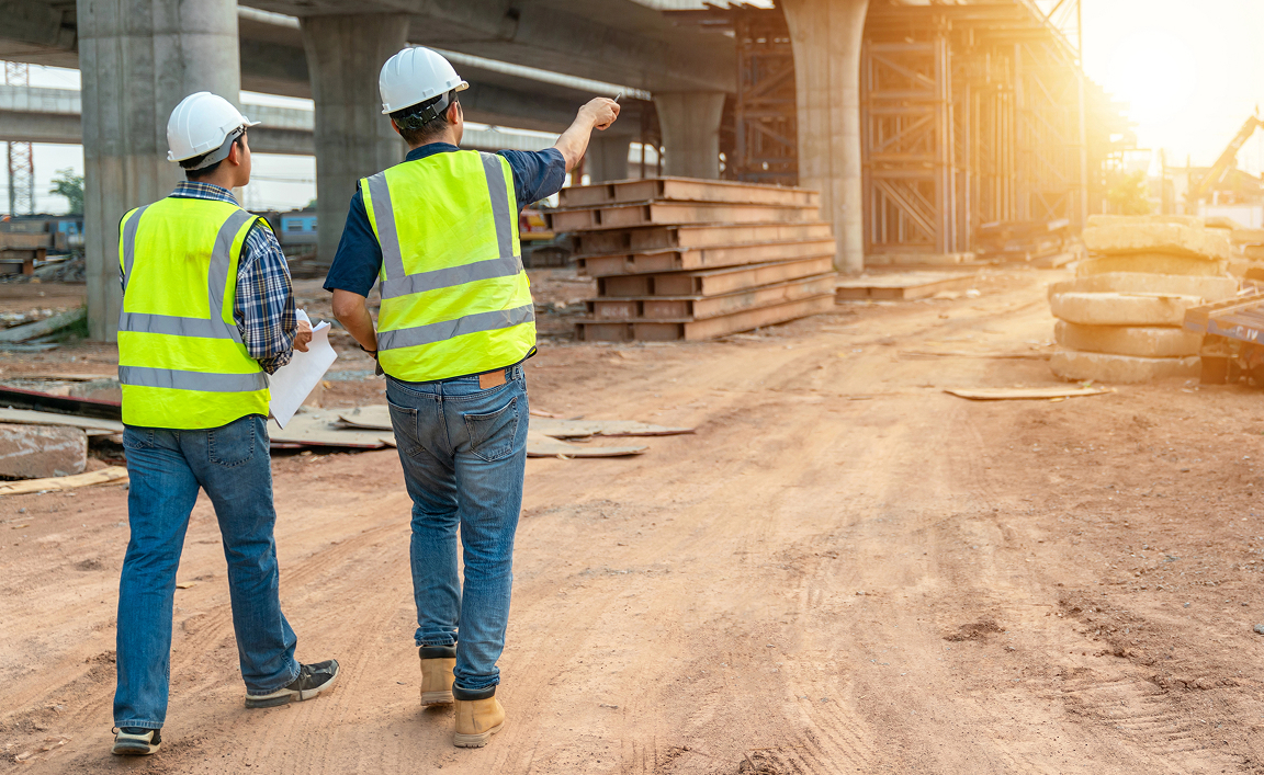 two-people-interacting-in-safety-training Two workers walking toward project